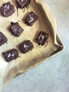 Homemade chocolates filled with almond butter, topped with sea salt