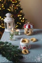 Homemade christmas bakery, vanilla crescent cookies with candles, christmas tree and bokeh Royalty Free Stock Photo