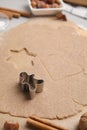 Homemade Christmas biscuits. Dough and cookie cutter on table, closeup