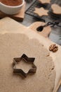 Homemade Christmas biscuits. Dough and cookie cutter on table, closeup