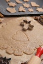 Homemade Christmas biscuits. Dough and cookie cutters on table