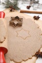 Homemade Christmas biscuits. Dough, rolling pin and cookie cutter on table, closeup