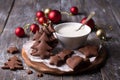 Homemade Christmas chocolate spiced cookies with sugar icing for decoration on a wooden table Royalty Free Stock Photo