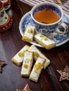 Homemade Christmas cookies with a cup of tea, top view over a rustic wood background Royalty Free Stock Photo