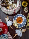 Homemade Christmas cookies with a cup of tea, top view over a rustic wood background Royalty Free Stock Photo