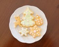 Homemade Christmas cookies plate on wooden background Royalty Free Stock Photo