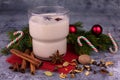 Homemade Christmas eggnog in cups. Traditional drink.