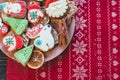 Homemade christmas gingerbread cookies on plate on wooden background. Snowflake, star, tree, snowman, deer shapes. Holiday, Royalty Free Stock Photo