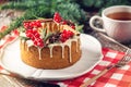 Homemade Christmas or New Year holiday berry cake decorated currants and rosemary. Concept of festive desserts