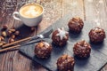 Homemade Christmas or New Year holiday chocolate brownies with nuts on wooden background. Concept of festive desserts