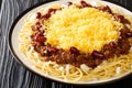 Homemade Cincinnati Chili Spaghetti with Red beans Cheese and Onion close up in the plate. Horizontal Royalty Free Stock Photo