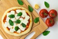 Homemade classic italian napoli pizza with tomato sauce, mozzarella cheese and basil leaves: pizza napoletana. Royalty Free Stock Photo