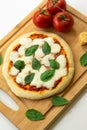 Homemade classic italian napoli pizza with tomato sauce, mozzarella cheese and basil leaves: pizza napoletana. Royalty Free Stock Photo