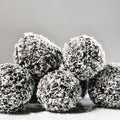 Homemade coconut rum balls on plate. Christmas sweets. Traditional homemade handmade Czech sweets. Royalty Free Stock Photo