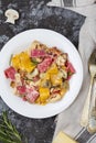 Colored papardelle with chicken, bacon and mushrooms