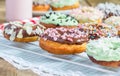 Homemade colorful donuts on a cooling rack