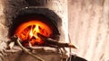 Homemade concrete wood fired stove in the dirty kitchen