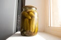 Homemade conservation of Salted pickled cucumbers preserved canned in glass jar