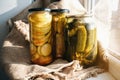 Homemade conservation of zucchini and cucumbers pickled preserved canned in glass jar