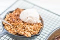 Homemade cooked rhubarb and apple crumble with oatmeal and vanilla ice cream Royalty Free Stock Photo