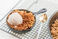 Homemade cooked rhubarb and apple crumble with oatmeal and vanilla ice cream Royalty Free Stock Photo