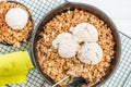 Homemade cooked rhubarb and apple crumble with oatmeal and vanilla ice cream Royalty Free Stock Photo