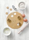 Homemade cookie preparation- raw dough, cutters, rolling pin and bowls with flour