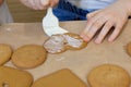 Homemade cookies with brown gingerbread for the holidays, covered with icing and decorated with balls. new Year`s mood