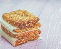 Homemade cookies, muesli bars with glass of milk on a wooden table