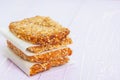 Homemade cookies, muesli bars with glass of milk on a wooden table