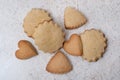 cookies in the shape of hearts, stars and triangles, top view