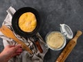 Homemade corn flatbread meal frying pan in male hand. Handmade mexican tortilla for wrapping. Traditional latin recipe Royalty Free Stock Photo