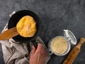 Homemade corn flatbread meal frying pan in male hand. Handmade mexican tortilla for wrapping. Traditional latin recipe Royalty Free Stock Photo