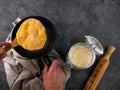 Homemade corn flatbread meal frying pan in male hand. Handmade mexican tortilla for wrapping. Traditional latin recipe Royalty Free Stock Photo