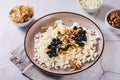 Homemade cottage cheese with fresh blackcurrants and walnuts on a plate Royalty Free Stock Photo