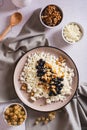 Homemade cottage cheese with fresh blackcurrants and walnuts on a plate top and vertical view Royalty Free Stock Photo