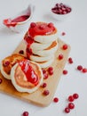 Homemade Cottage cheese pancakes or Syrniki with cranberry jam. Royalty Free Stock Photo