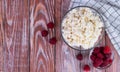 Homemade cottage cheese and ripe raspberries on the wooden table. Healthy breakfast. Top view. Close-up. Copy space Royalty Free Stock Photo