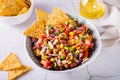 Homemade cowboy caviar traditional mexican vegetable salad and nachos in a bowl on the table Royalty Free Stock Photo
