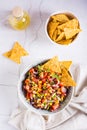 Homemade cowboy caviar traditional mexican vegetable salad and nachos in a bowl. Top and vertical view Royalty Free Stock Photo