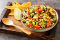 Homemade Cowboy salad or Texas caviar bean dip lime dressing, served with tortilla chips closeup in the bowl. Horizontal Royalty Free Stock Photo