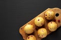 Homemade Cranberry Muffins with Orange Zest on a rustic wooden board on a black background, top view. Copy space Royalty Free Stock Photo