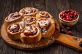 Homemade cranberry and orange swirl buns wuth glaze.