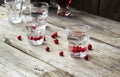 Homemade cranberry vodka, wooden background Royalty Free Stock Photo