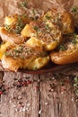 Homemade crash hot potatoes with thyme and cheese close-up. Vert