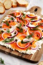 Homemade Cream Cheese Lox Bagel Board with Salmon on a white wooden surface, side view Royalty Free Stock Photo