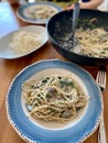 Homemade Creamy Mushroom Spaghetti Pasta on Wooden Table with Wok Royalty Free Stock Photo