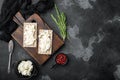 Homemade Crisp bread toast with Cottage Cheese, on black dark stone table background, top view flat lay, with copy space for text Royalty Free Stock Photo