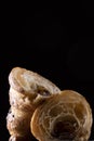 Homemade croissant cut in half on a black background Royalty Free Stock Photo