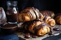 homemade croissants, filled with chocolate and hazelnut ganache, drizzled in chocolate sauce